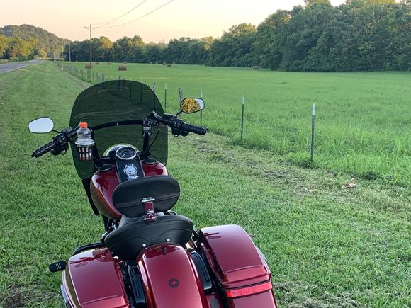 Best I could do. Not full blown harvest time in north Alabama or southern Tennessee so new hay rolls is whatcha get. 
One of the things Wifey and I like to do is visit old cemeteries. Some of the headstones provoke our thinking about the families buried there and the stories they tell of their passing. So the next challenge is your bike with a cemetery sign or entrance. Bonus points for pics of really old headstones.
