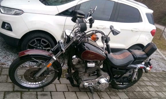 she's 100% original according to the seller . . . the only thing i can see its missing 1 chrome fork slider dust cover . . .