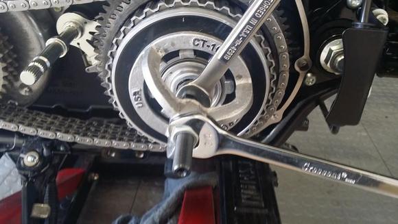 crank till you can get the spring seat and new retaining ring on