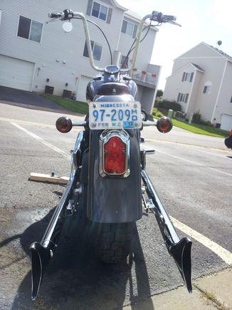 Rear Wide Tomsbstone tail light with standard NT strut-mounted turn signals. Also used Laydown license plate bracket (but had to mount  approximately 1/2" higher due to the Tombstone kit). I used small black plastic hole plugs to fill the factory license plate mounting holes.