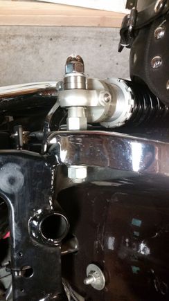 Here's the stock upper mount with shock installed and one of the provided spacers for the acorn nut to tighten down onto. Without the spacer, there aren't enough threads, as the Ohlins shock eye is about half the thickness of the factory shock eye.