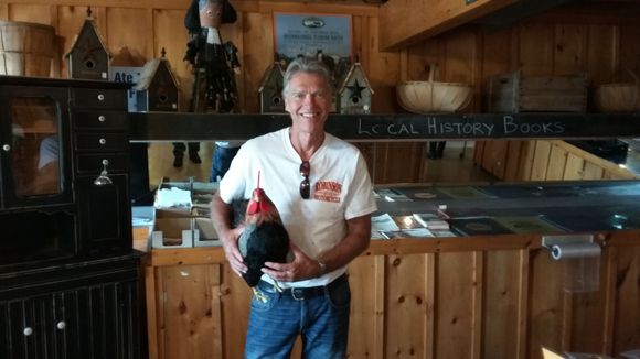Paul with his new found rooster friend. No folks it's not alive. Lol