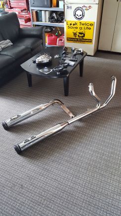 The stock header has the cat removed. These were on a 2011 ultra classic.  Header is from 2011,  the slip ons are a year old.  Im puting a bigger motor in my bike and going with a 2-1 pipe. 

$300 or best or trade. 

Also have other parts. All open for offers or trade. Id let all of it go for a set of stock 13 inch 12 way adjustable shocks off a newer ultra.