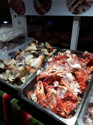 Lots of excellent selection of fresh fish, octopus, squid, crab, snapper and even lion fish. Load up with any combination and they will price it and cook it!