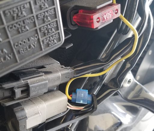The Yellow  wire was spliced to the Red/Yellow wire, switched power, behind the P&A connector under the left side panel.