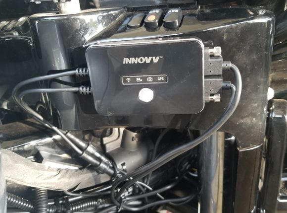 Easily accessed when HB's are turned full left.  If you look close you can see the power module affixed to the frame with the automotive high strength double stick tape tucked in behind the large main harness.