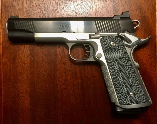 Springfield Ronin 9mm. Of all the ones posted, this is the only one I kept, and the least expensive.
