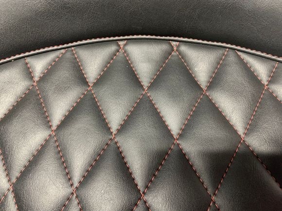 Close up of dark cherry Diamond Stitching.