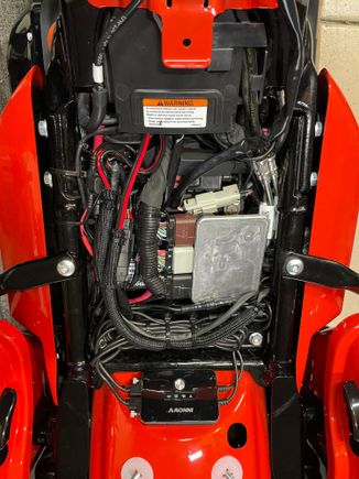 Ended up having to take out the factory cover that fits above the battery.  Gives me much more room.  And everything fits great.  Took some measurements and going to 3D print some caps for the terminals just to make sure nothing crosses them. 