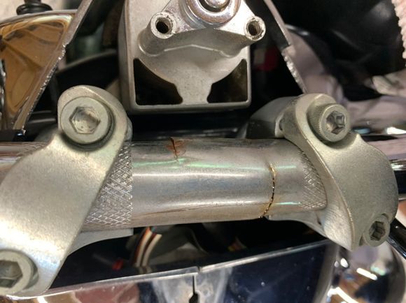Two cracks, probably from the holes drilled for internal wiring and 100k.