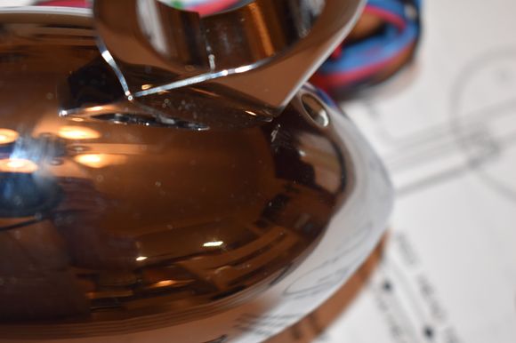 Slight scratch in the chrome next to the mount. On the bottom of the unit. Hard to see.