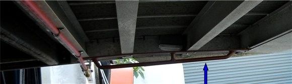 Motorcycle secure bar for chain & your front wheel. Underneath
