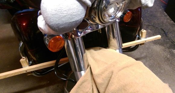 Hose clamped V-blocks to keep the drill aligned, as low as I could get them, canted outwards 15 degrees each.