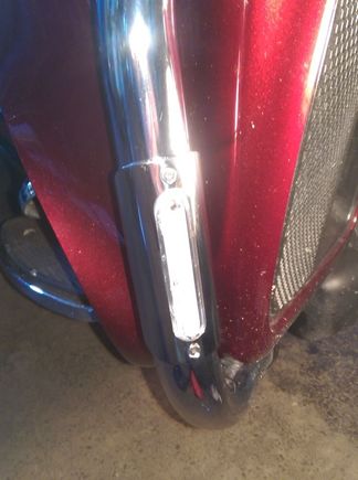 The clear plastic part houses the LED assembly snaps over the tubing and is sealed to the tubing all the way around with a squished layer of silicone.  You can see if it seals.  Then the metal cover snaps in place and is screwed down.  The clear plastic is visible all the way around the metal cover (it's the same size) and light gets out around the edges, which is cool.  The clear part sticks out past the metal by about 1/8" or so, adding to side visibility.