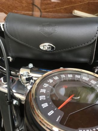 Bar and Shield Leather Windshield Bag.  It holds your phone, garage door openers and any small tool and paper work.