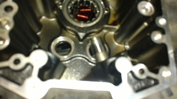 Picture is kind of fuzzy, but this is the rear intake lifter.  It's jammed in the case and will not move.