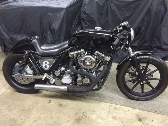 87' FXR, hopped up stroker, aluminum tank, hand built rear fender and seat, progress 412 shocks and a late model narrow glide, 100% LED lighting, RSD cafe style bars grips and speedo mount, GMA front/rear brakes w Drilled and polished rotors, stock HD wheels powdercoated black, with decked out stroker!