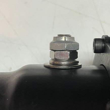 Mounted ¾" back from where the baffle meets the end-cap.  Stacked the bolt with a locking-nut (McMaster Carr!).