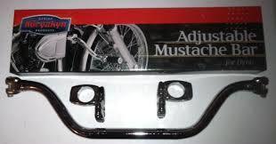 This is a mustache bar. They bolt across the frame a little bit under the bottom of the frames neck.
