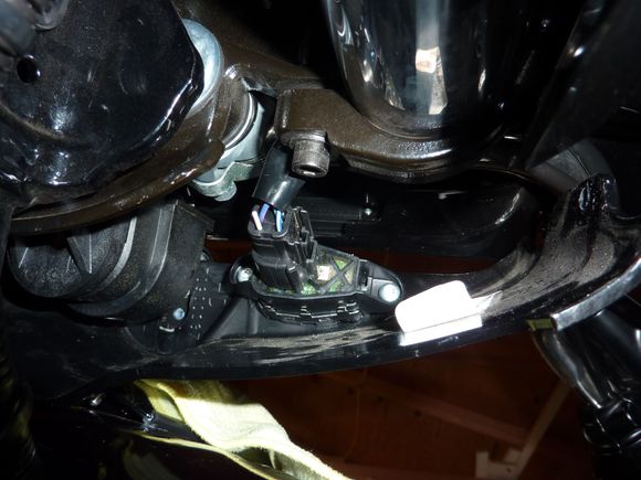 Underside of ignition switch cover showing the left side accessory plug.