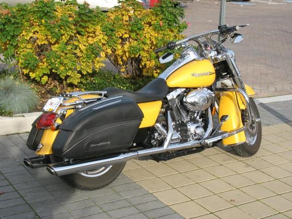 under slung mirrors, hand made stainless side trim above road king emblem on bags. rear tail light sloped