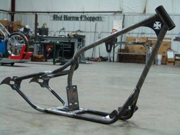 New Red Barron Choppers NEMESIS 200 frame.

It's the BARRON's signiture masterpiece - the NEMESIS 200R remains our top selling frame, and for good reason; massive reinforced gussets and high strength .120 seamless DOM tube flow together in a stunning drop seat profile that simply can't be mistaken for anything else! features 6" backbone with 4 up rise and 40 degree neck rake. fits your 2003 and older EVO years sportster or type frame type buell ( will also fit older sportys clear back to 57 with very minor mods )