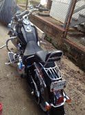 Meet the Vixen my 2011 Deluxe w/ ABS, windshield, engine guard, sissy bar, passenger backrest, highway pegs, extreme cycle radio w chrome handlebar speakers, garmin GPS, and rhinestone trim pieces form the harley diamond ice collection that I got in Nov of 2011 after trading in my 08 883 Custom Sportster named the red mistress.