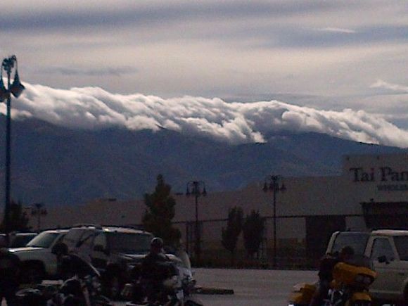 Beautiful view of the clouds hanging on the moutains.