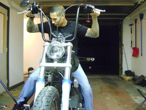 jacking her up while sitting on /balancing the bike (do not try without practice!)