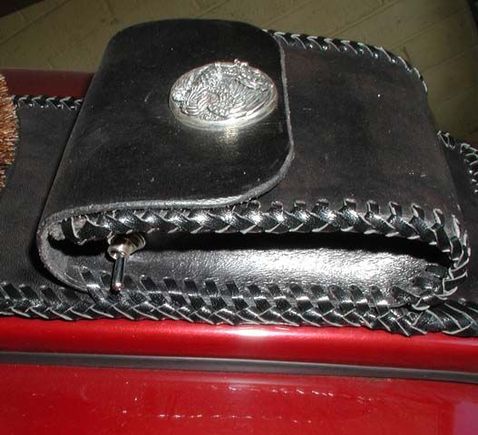 In this closeup of the pouch a spring loaded momentary switch can be seen. It activates the garage door opener! As I'm rolling up to the house I press that switch for a moment and door is open!