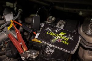 This device, a little bigger than an iphone, or another brand.  Lowe's and Home Depot have one at less cost, but I can vouch for this one.

A guy had a weak battery and didn't turn his ignition off, used it to jump his bike, worked easily.

This saved him a lot of time and expense, and i got to see it in action.