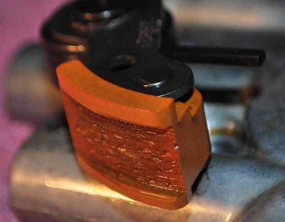 Old-style spring tensioner on a link chain never stops wearing.