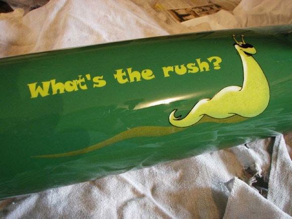 The fuel tank was created from a compressed gas cylinder he cut in half. The slug logo is a long story...