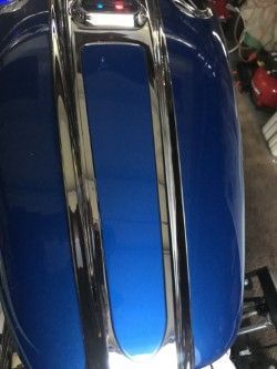 CENTER CONSOLE, MY PAINTER DOING SOMETHING THERE AS WELL, AS THAT BLACK BREAKOUT SPLASH GAURD IN REAR TIRE AREAM, ITS A SURPRISE TO ME, HE SAID YOU WANT CUSTOM, LOL