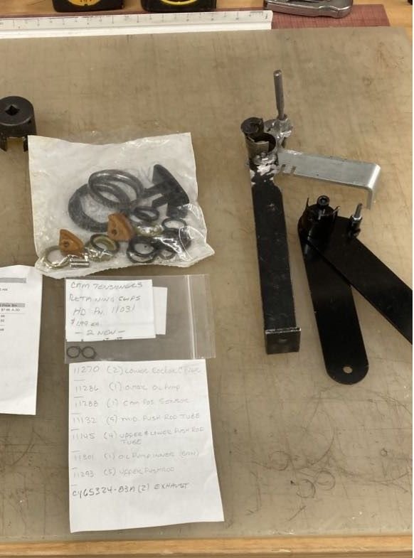 Two tools for holdign tensioners for install and removal. Home made and ebay. Old parts. List of gaskets. 