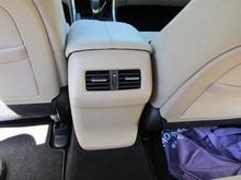 Rear passenger air controls.