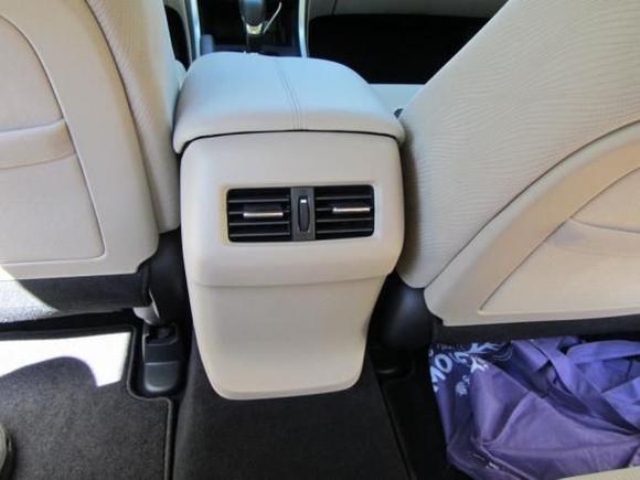 Rear passenger air controls.