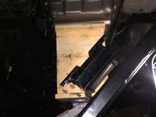 Dropped the crossmember holding trans up.

Used the wooden box in background to hold up transmission while I dropped cross member.