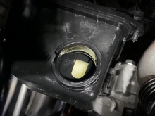 Milky fluid in reservoir after hearing screeching noise.