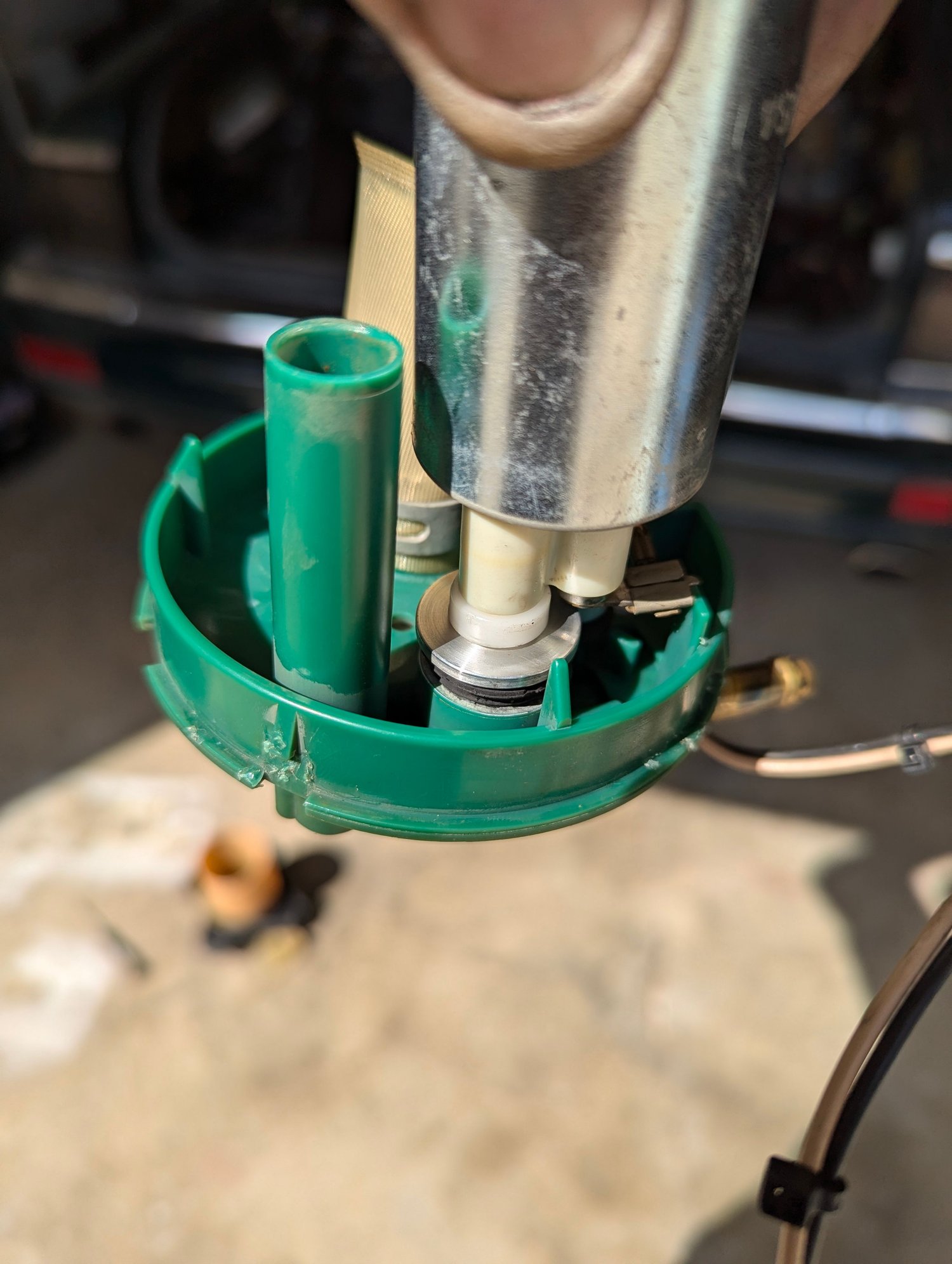 Should not be a gap between pump and green plastic. Seal had blown out  Piece of plastic broken off, PO must have left it out.  Not sure if aluminum part is original.  Both pump housings had same problem.