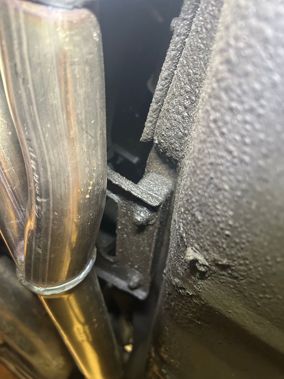 The right end behind the exhaust
