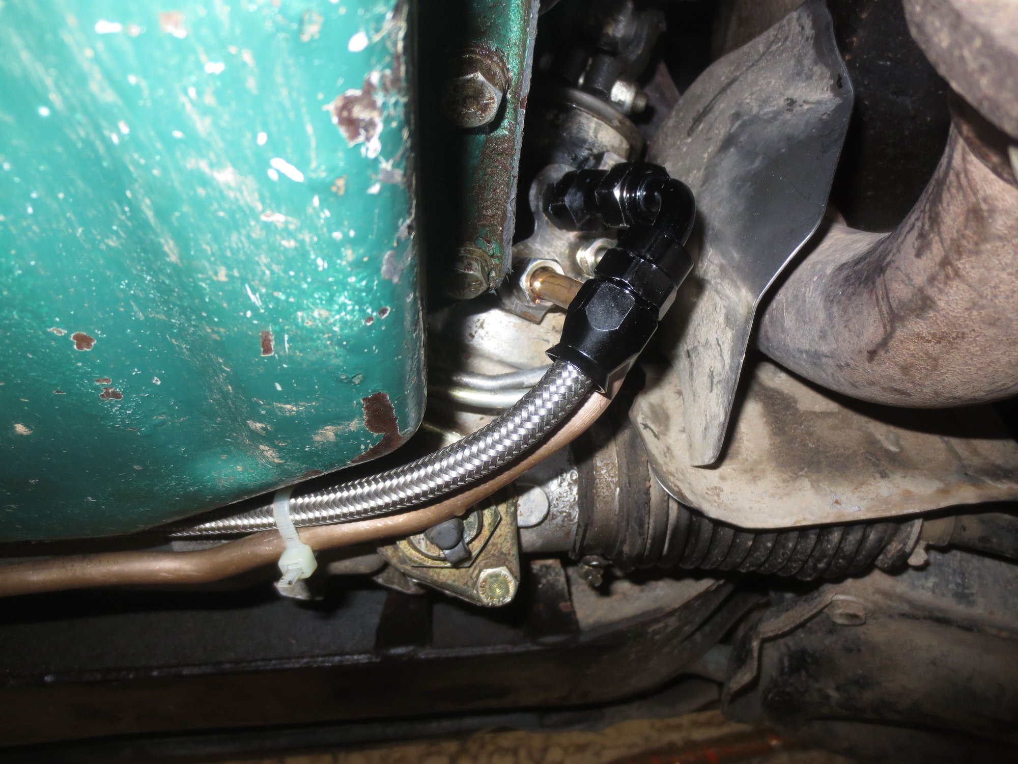 Hose runs between rack and sump