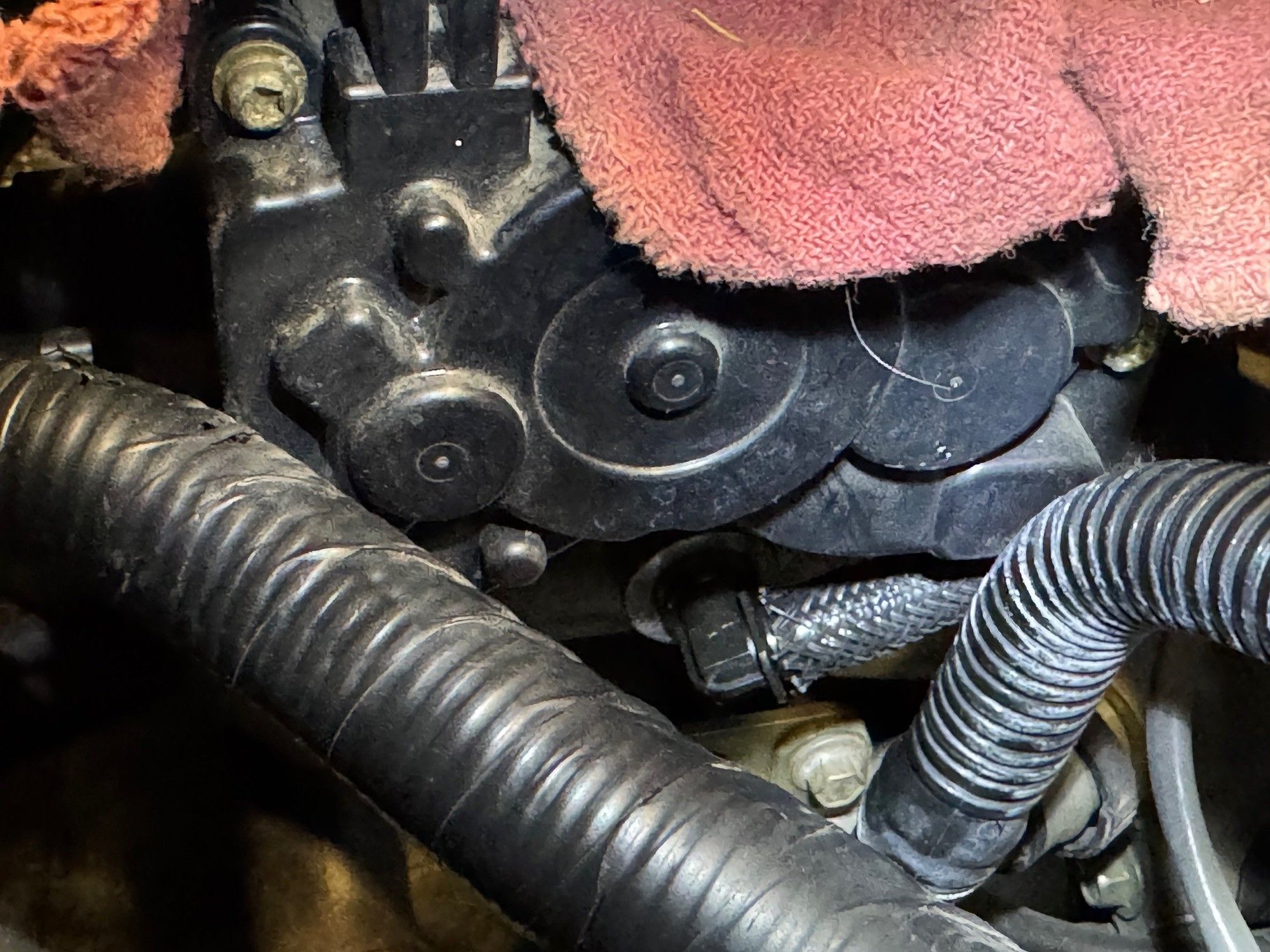 Plastic angle connector vac fitting. Snakes around and connects to hard plastic line that goes to 2-3 places