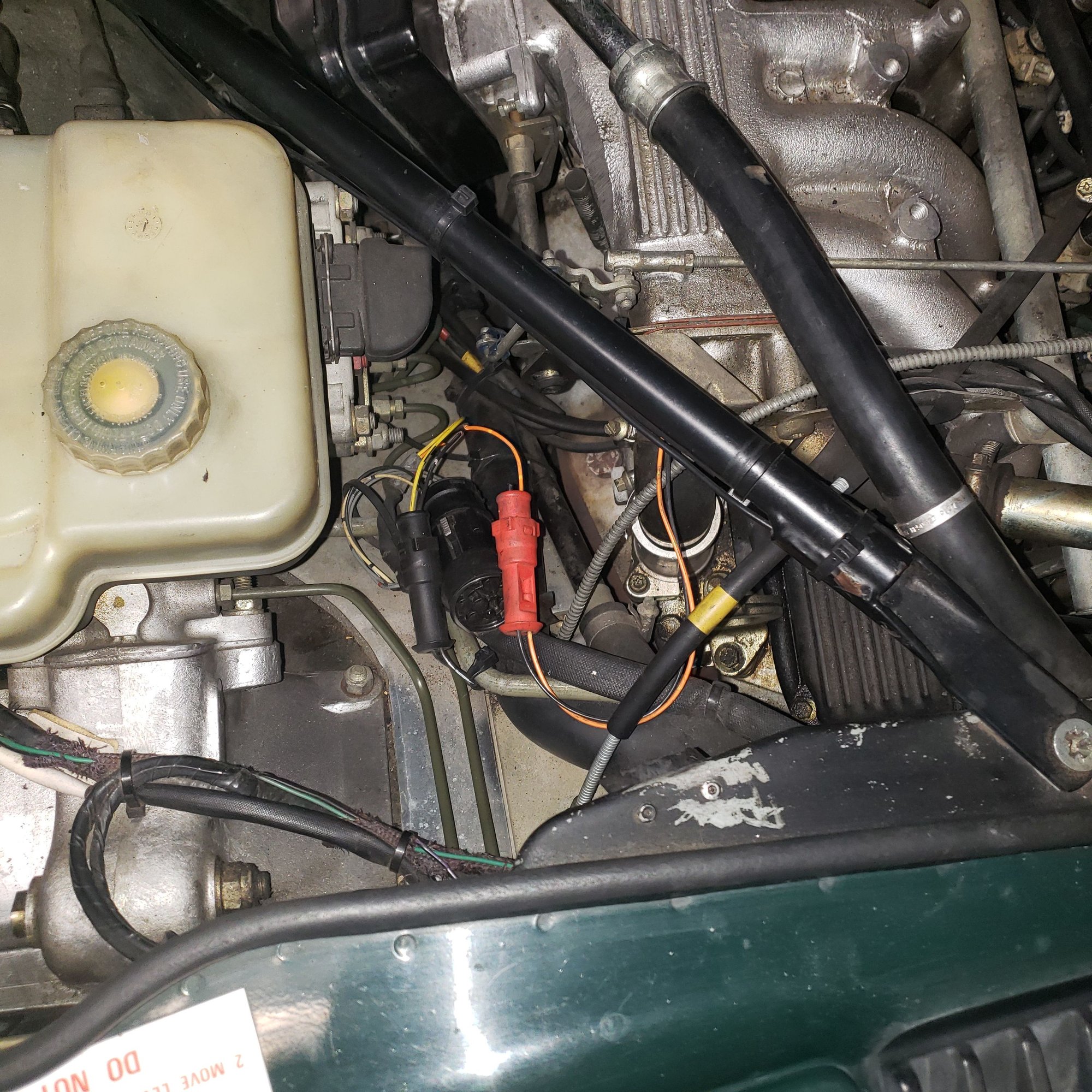 Can someone tell me what this red colored part is.  I noticed the wires to it are broken and 1 wire is too short and cant be reattached.  So hoping I can get a replacement but Ive looked thru the service manual and cant seem to find it.  Its on the drivers side near the firewall.  Also anyone know where to get replacement harnesses?   Ive seen some on ebay that had crazy high prices.