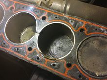 The great divide between Cyl 2 &3...it's painful to admit how much like a vacuum leak this initial failure felt like.  A compression test should be on the list right after the usual vacuum line tests. Lots of deformation around the coolant passages, note how much smaller the holes in the gasket are compared to the block and head (next pic)