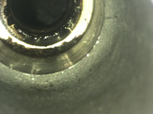 Sludge surrounding spark plug hole
