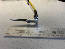 I cut down and reduced the width of the tool from the bend to the blade to stop it snagging on the edge of the hole. I also used a 4mm nut and bolt which made it easy to change the blade after a few failed attempts 