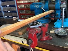 Pic shows how I used my red bench vise to secure the thermo housing and used a heavier blue vice as a pivot point to use the wood to compress the thermostat while twisting the wings under the tabs.