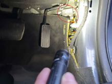 The module is located behind the accelerator pedal on my RHD XKR, secured with two 8mm bolts.