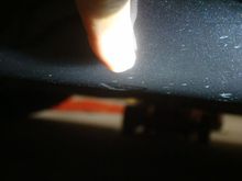 Arrow indent at sill edge, 7.25" rear of wheel well